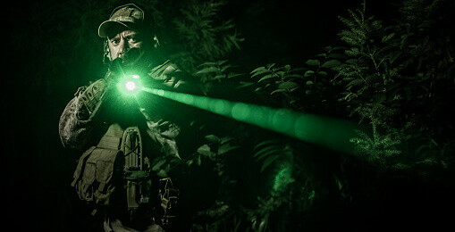 Mil-sim player using a laser