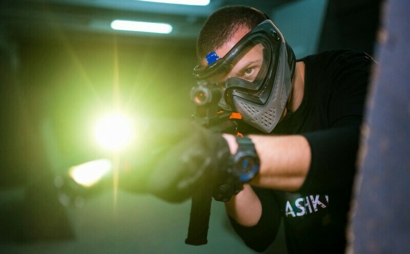 player using a weapon mounted flashlight