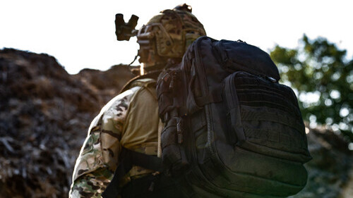 Operator with a military surplus backpack